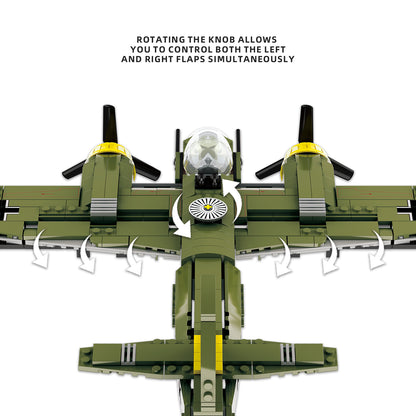 Green military plane building block model with rotating knob to control flaps, featuring dual propellers and cockpit details.